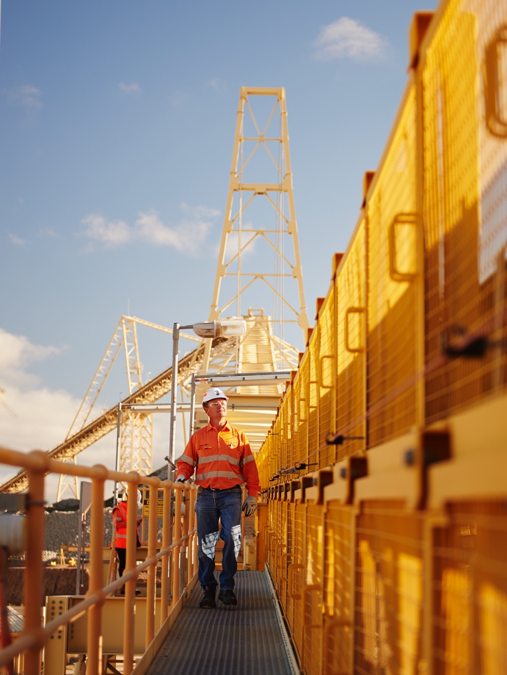 Worker walking on machinery
